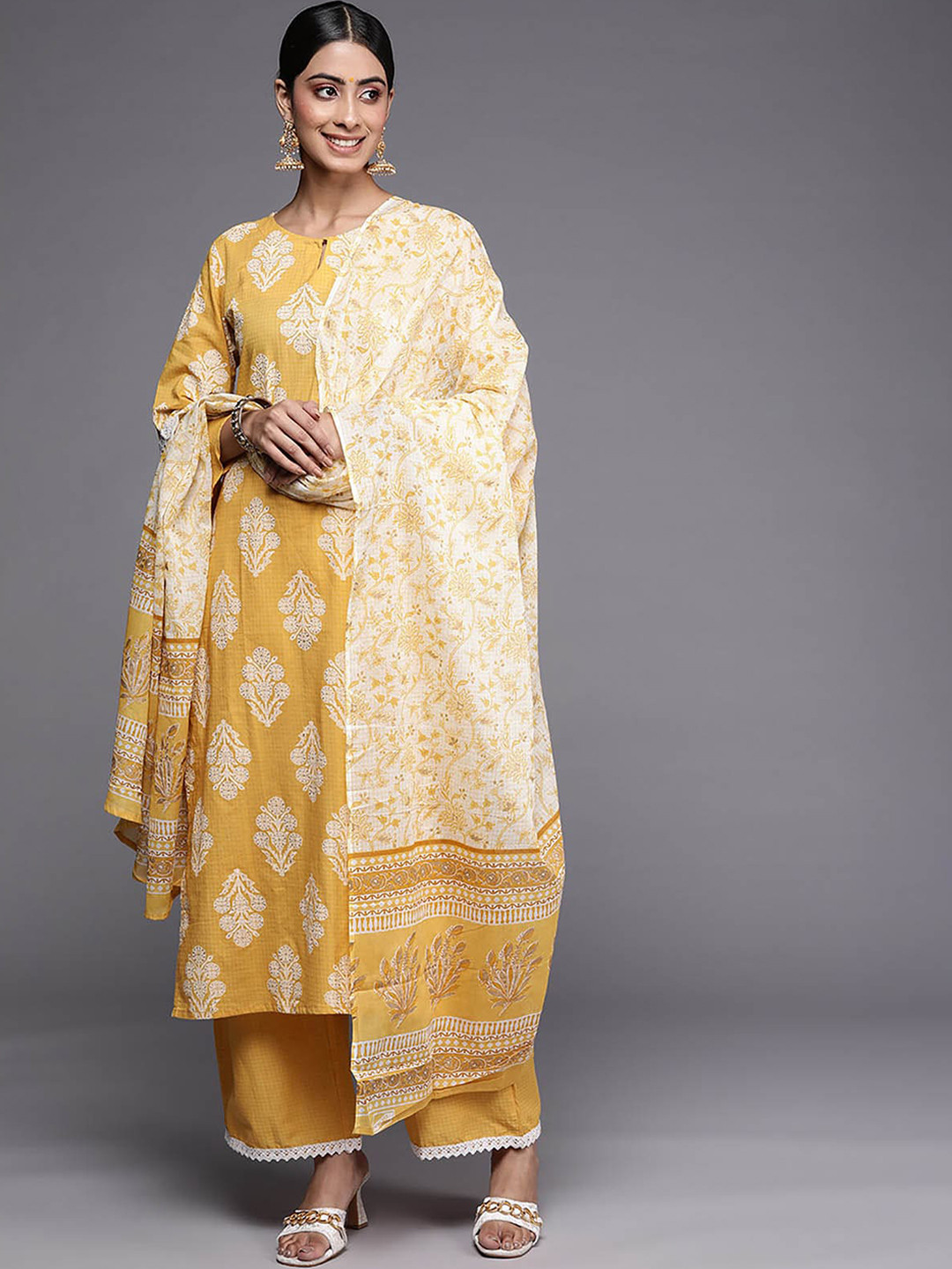 

ODETTE Women Yellow Floral Printed Kurta with Sharara & With Dupatta