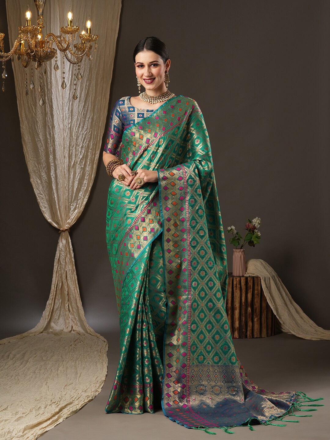 

Saree mall Teal & Gold-Toned Woven Design Zari Silk Blend Patola Sarees