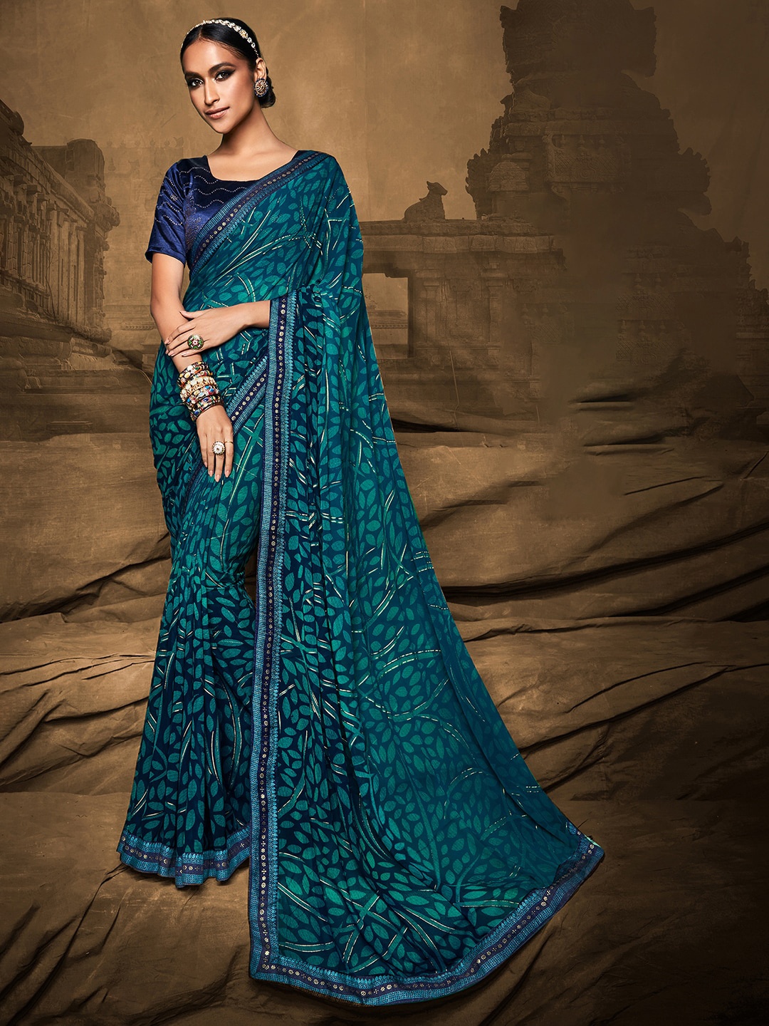 

Mitera Teal & Green Floral Silk Blend Bagh Saree