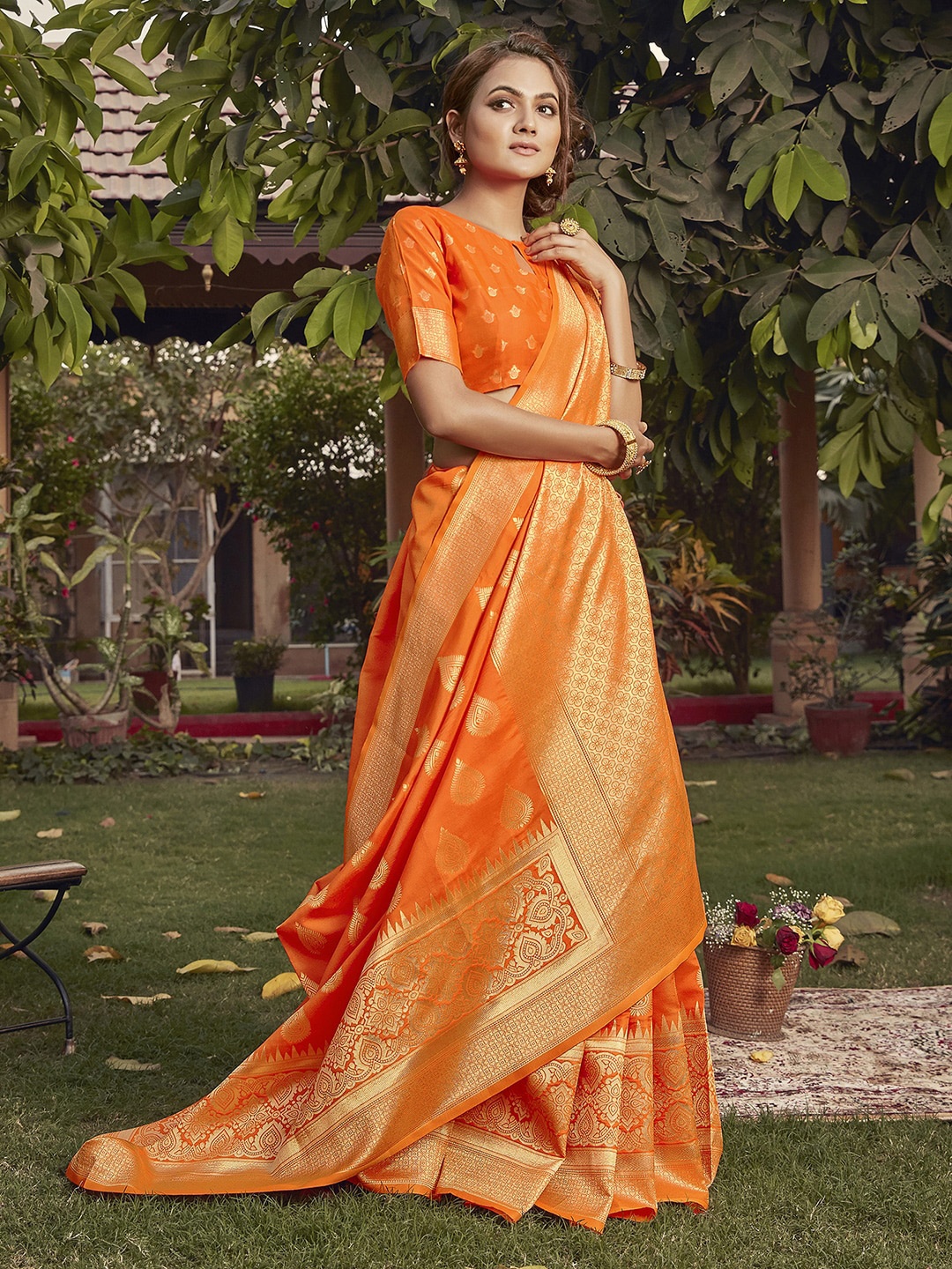 

Mitera Orange & Gold-Toned Ethnic Motifs Zari Bagh Saree