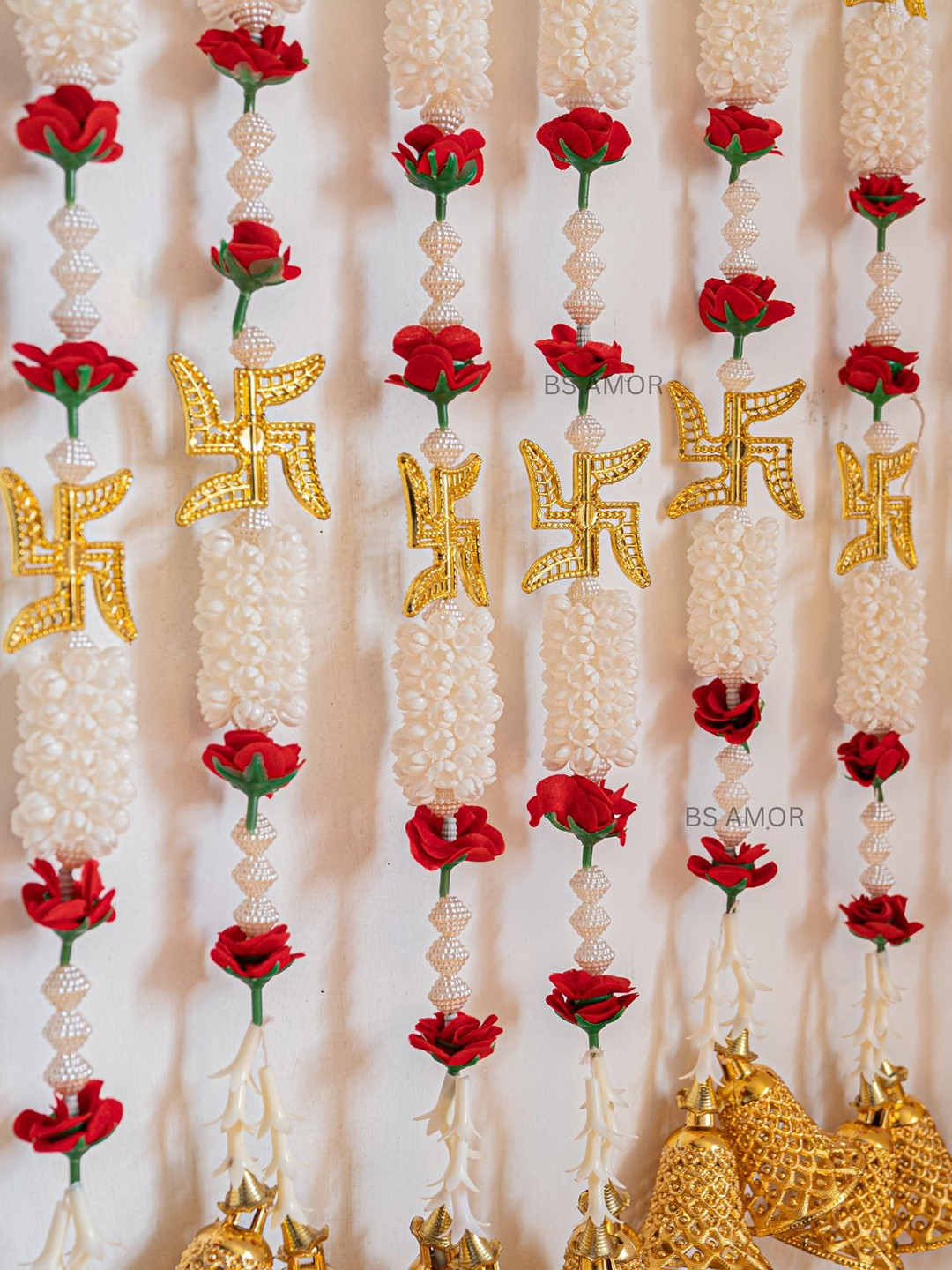

BS AMOR Set Of 2 Gold-Coloured & White Swasthik Khushi Mogra Wall Hanging