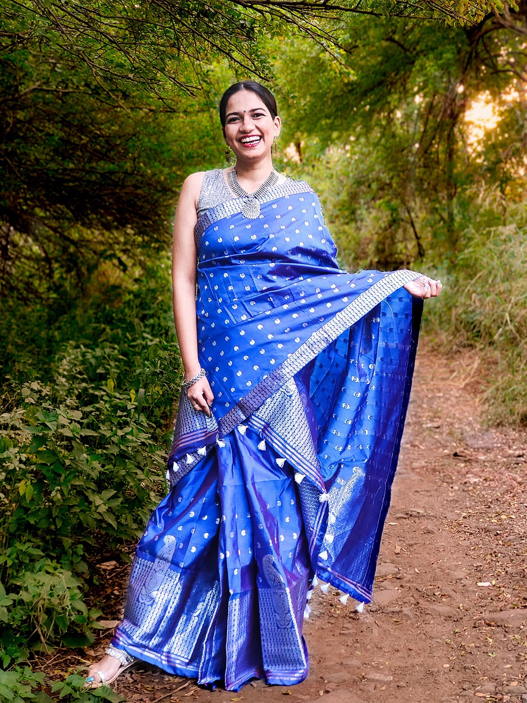 

Apaapi Threads of glory Blue & Silver-Toned Ethnic Motif Zari Saree