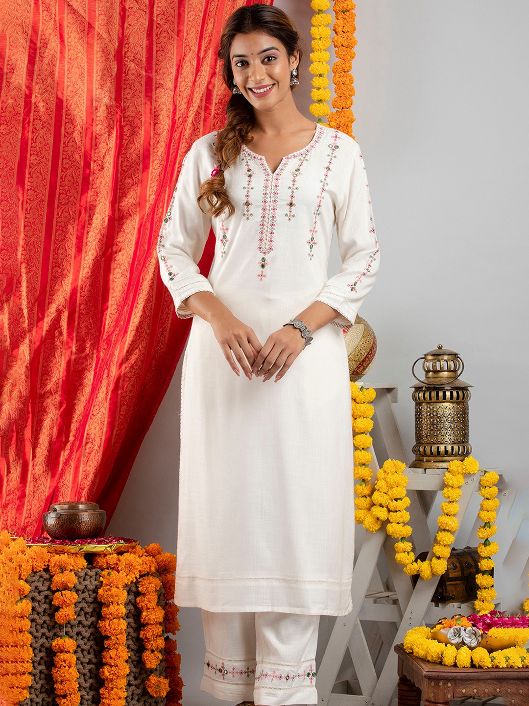 

SUTI Women Off White Ethnic Motifs Embroidered Mirror Work Kurta with Trousers