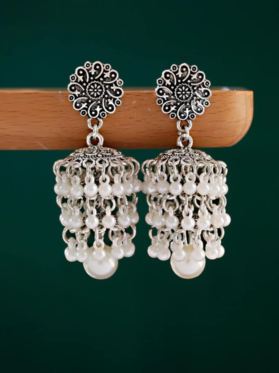 

OOMPH White & Silver-Plated Oxidised Dome Shaped Jhumkas Earrings