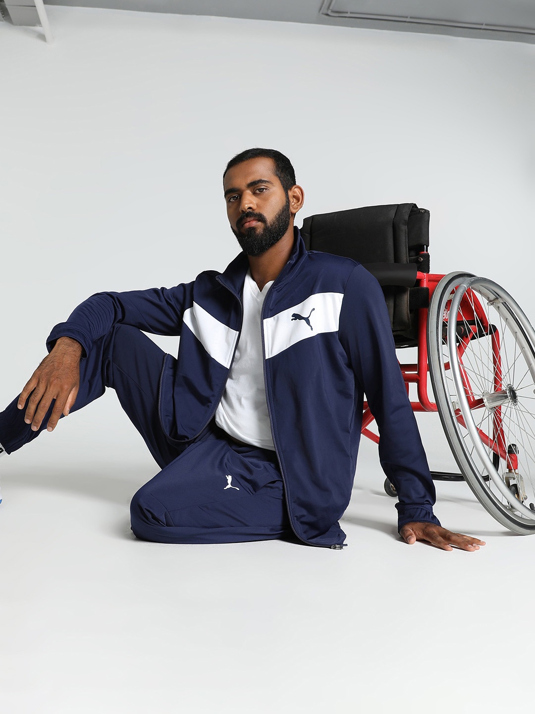 

Puma Men Navy Blue & White Colourblocked Cricket Tracksuits