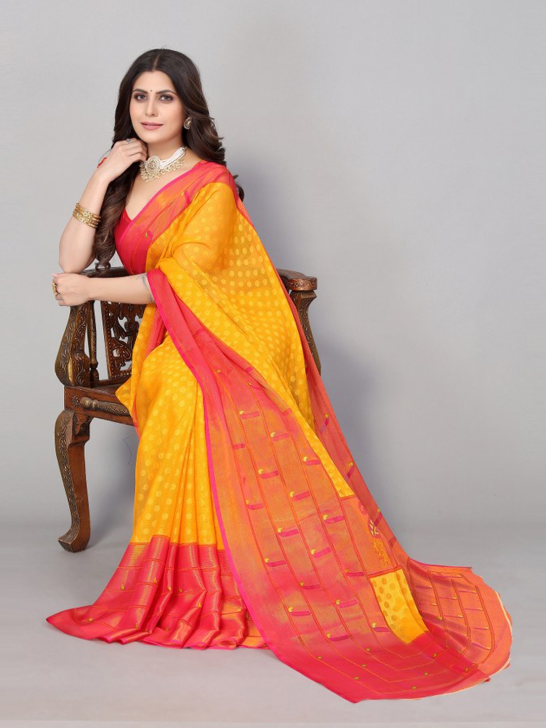 

KALINI Yellow & Orange Ethnic Motifs Saree