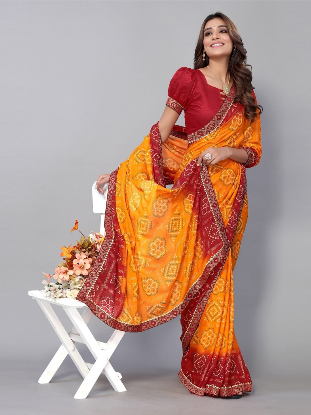 

KALINI Yellow & White Printed Bandhani Saree