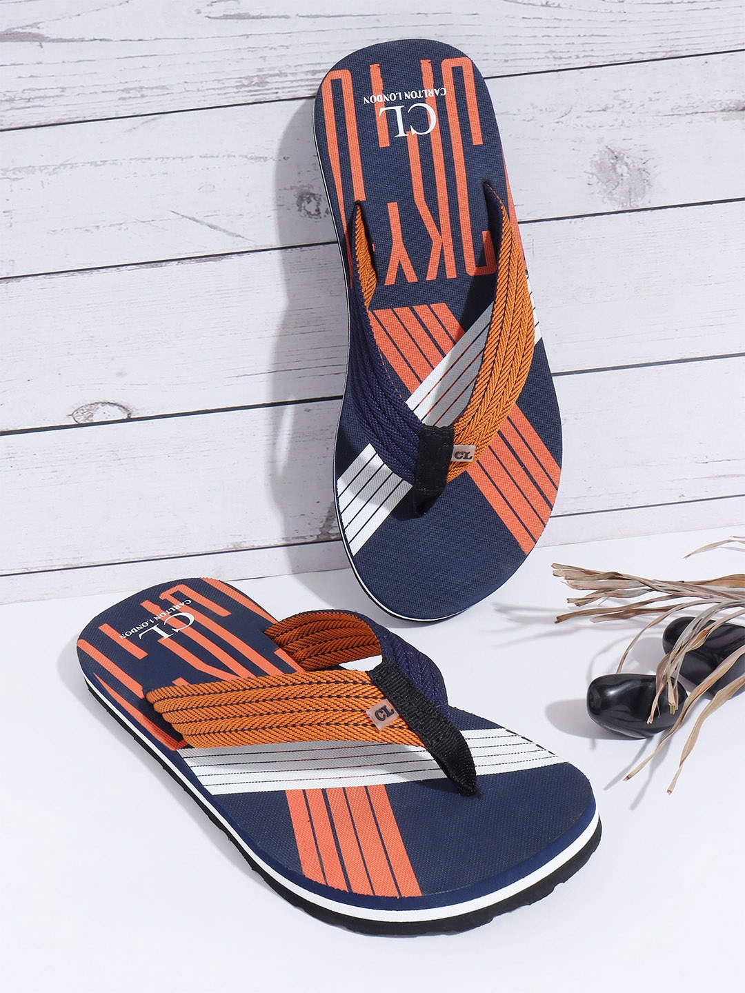 

Carlton London Men Navy Blue & Orange Printed Thong Flip-Flops