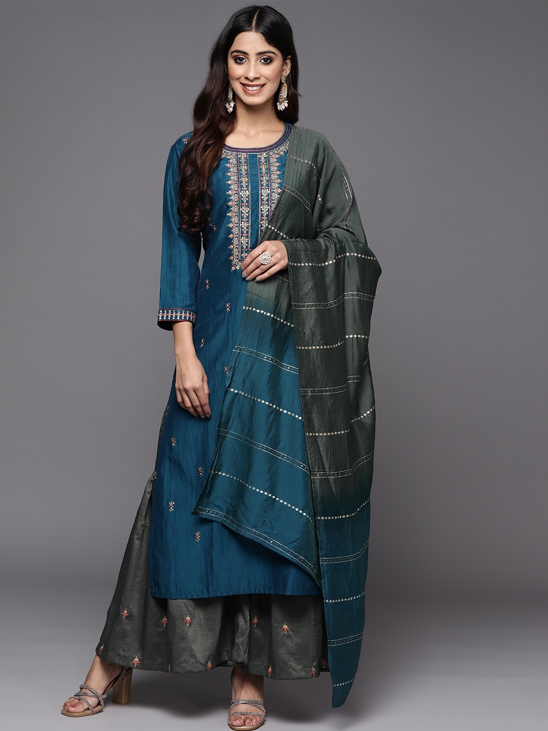 

Varanga Women Teal Ethnic Motifs Embroidered Thread Work Kurta with Sharara & With Dupatta