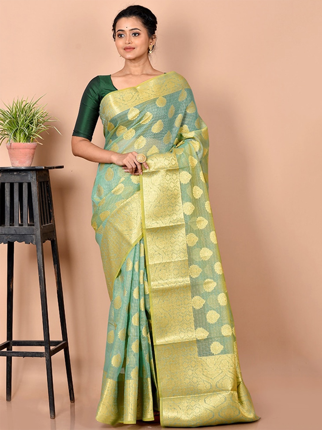 

AllSilks Sea Green & Gold-Toned Ethnic Motif Woven Design Zari Silk Cotton Saree