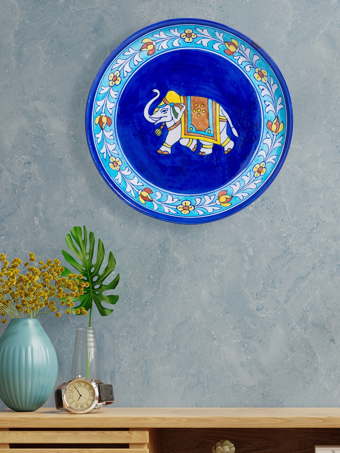 

Golden Peacock Blue & White Handpainted Pottery Elephant Design Wall Plate
