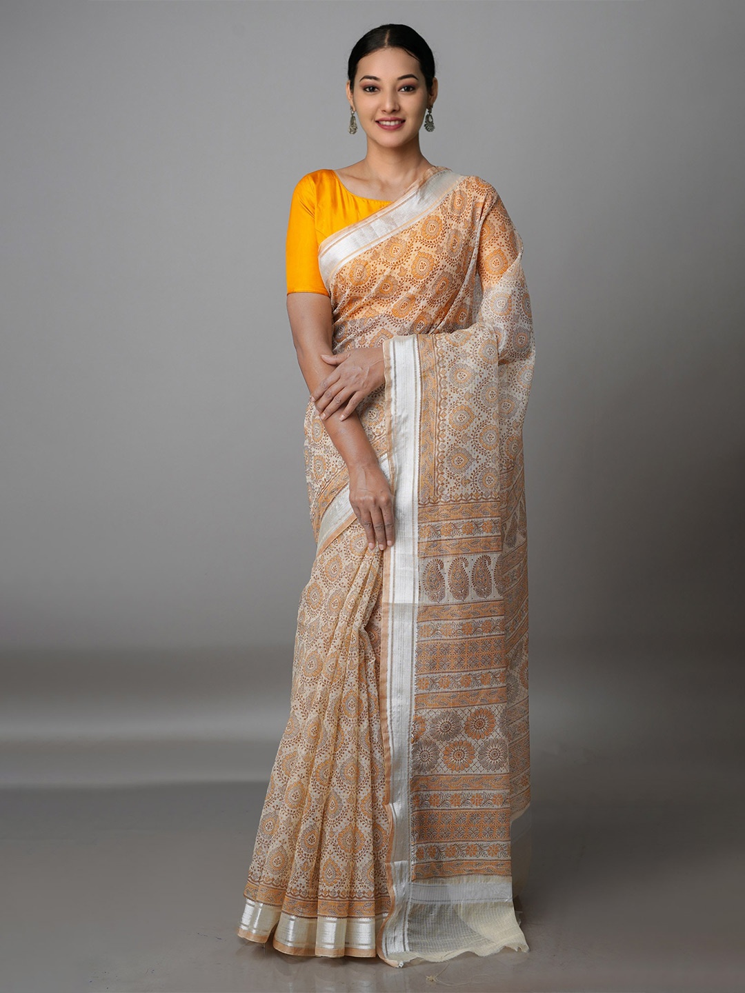 

Unnati Silks Cream-Coloured & Silver-Toned Ethnic Motifs Zari Pure Cotton Kota Saree