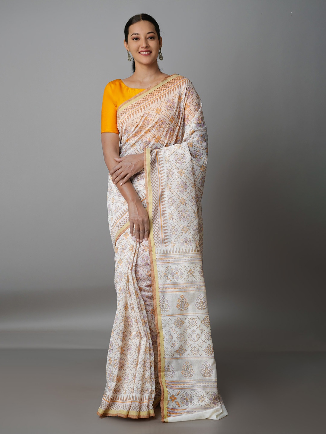 

Unnati Silks Cream-Coloured & Yellow Ethnic Motifs Zari Silk Cotton Chanderi Saree