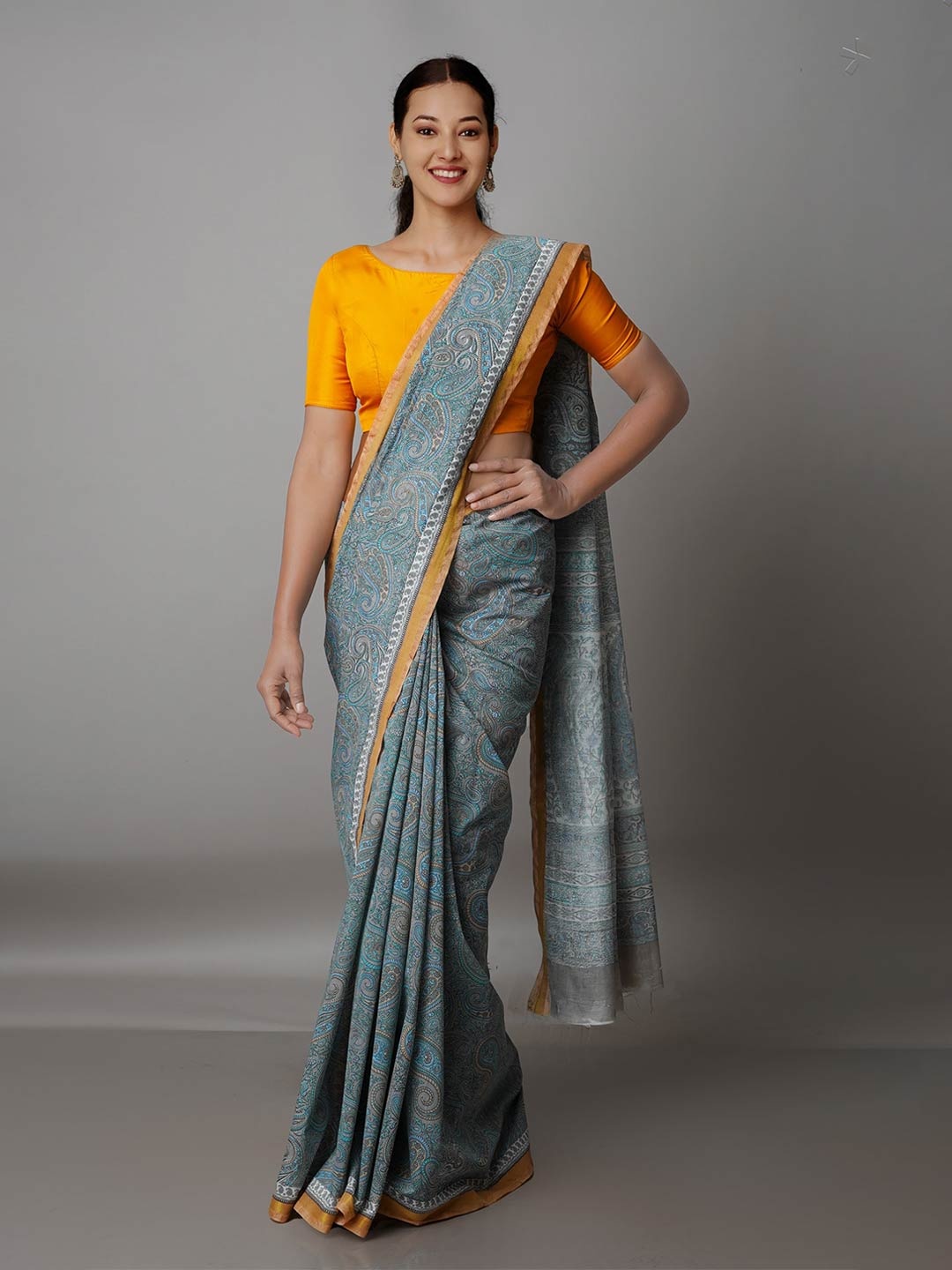 

Unnati Silks Grey & Blue Paisley Zari Silk Cotton Chanderi Saree