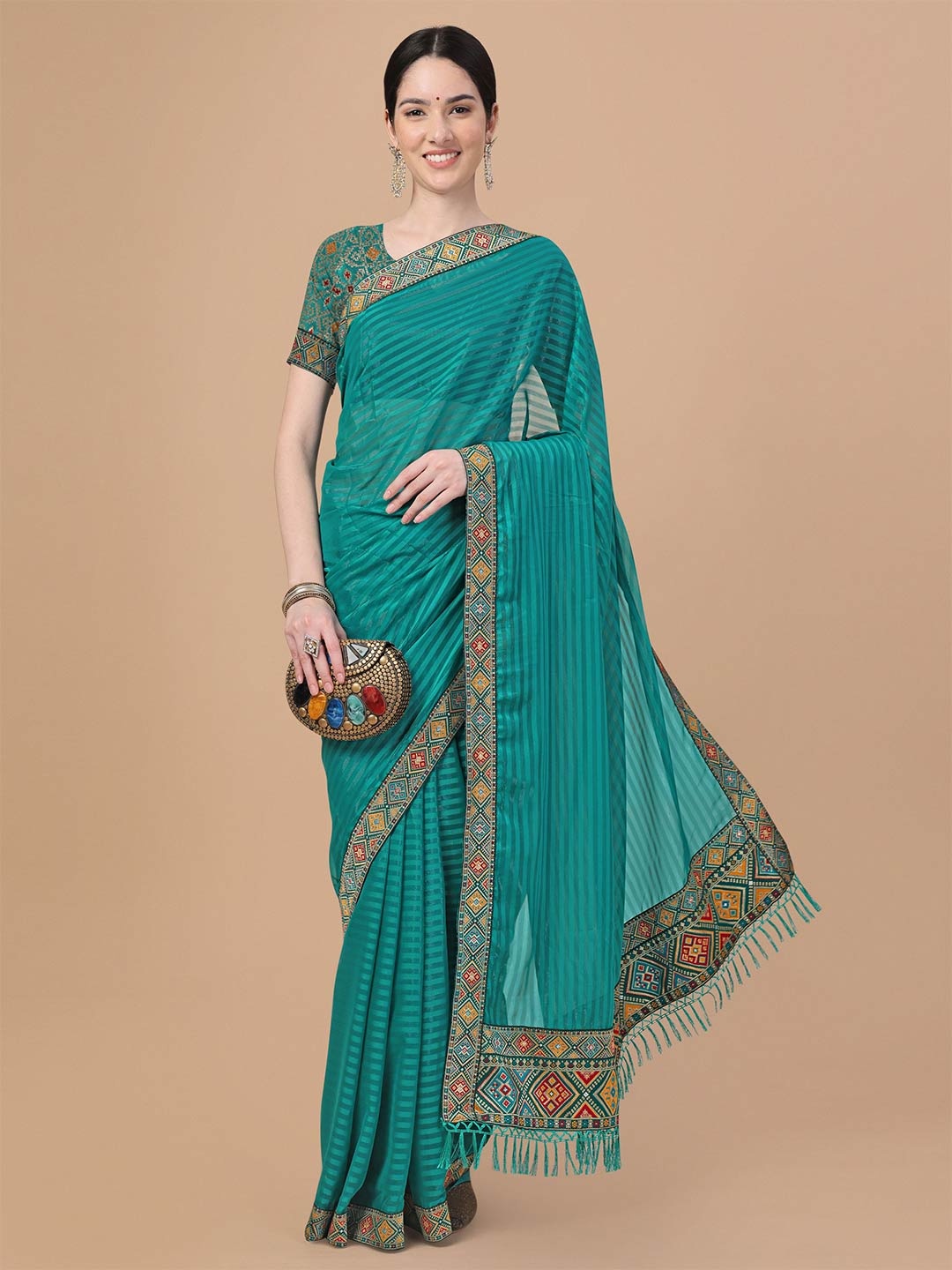 

Mitera Teal & Blue Striped Embroidered Art Silk Saree