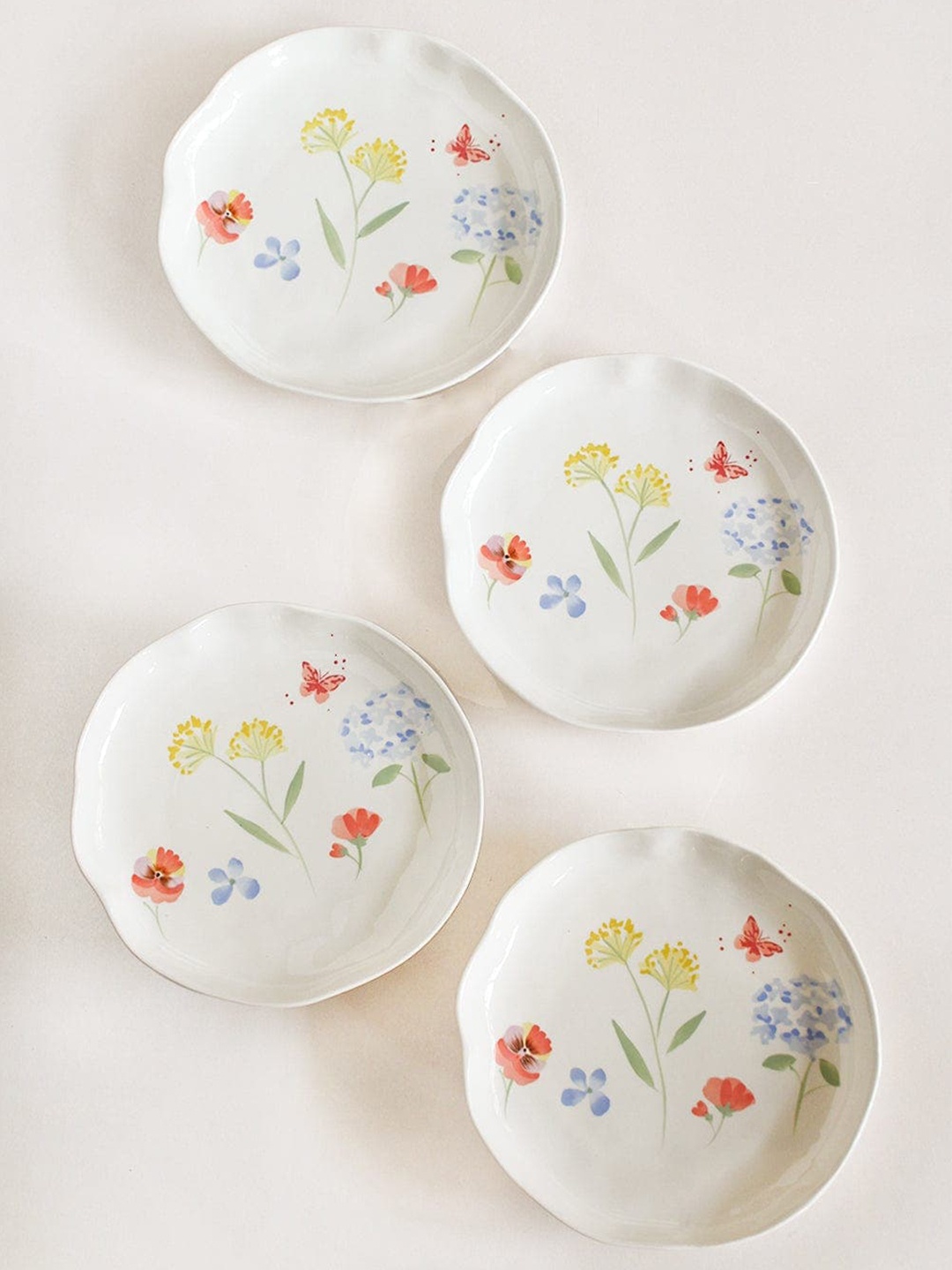 

The Wishing Chair White & Yellow 4 Pieces Hand Painted Printed Stoneware Glossy Plates