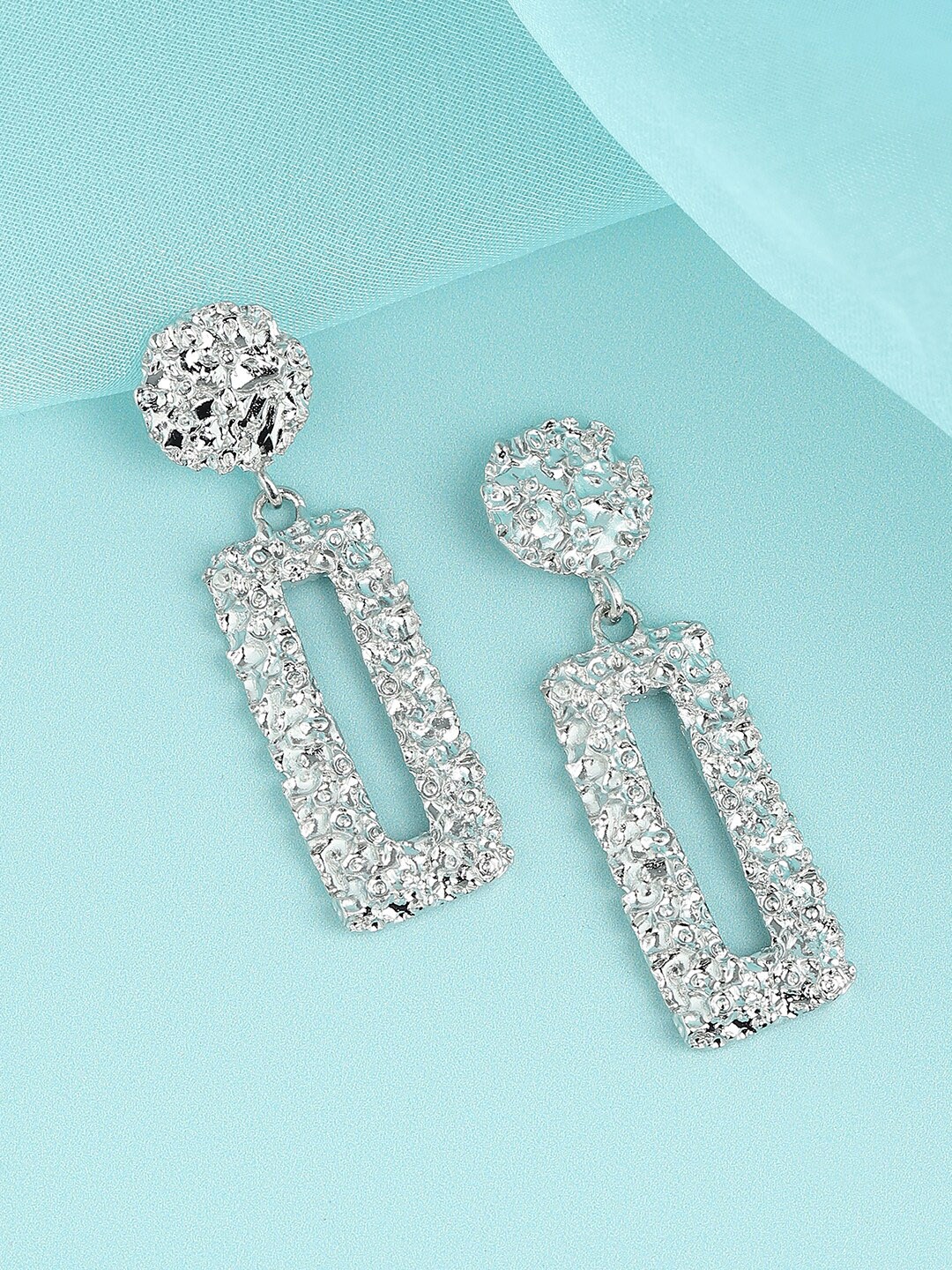 

SOHI Silver-Plated Contemporary Drop Earrings