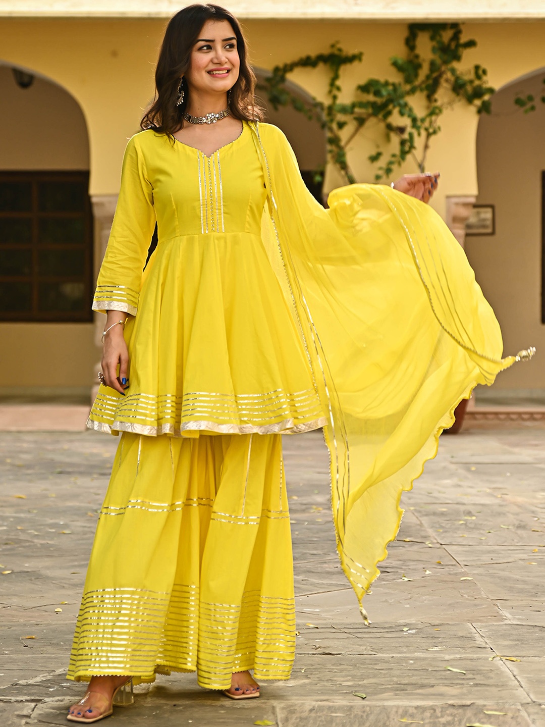

Bunaai Women Yellow Panelled Gotta Patti Pure Cotton Kurta with Sharara & With Dupatta