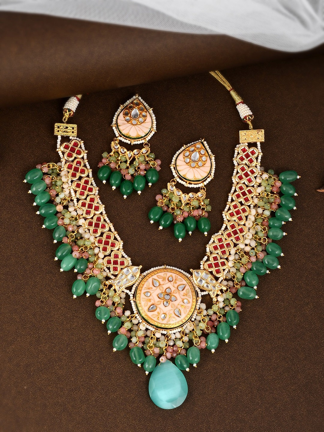 

DASTOOR Gold-Plated White & Red Kundan Studded & Beaded Jewellery Set