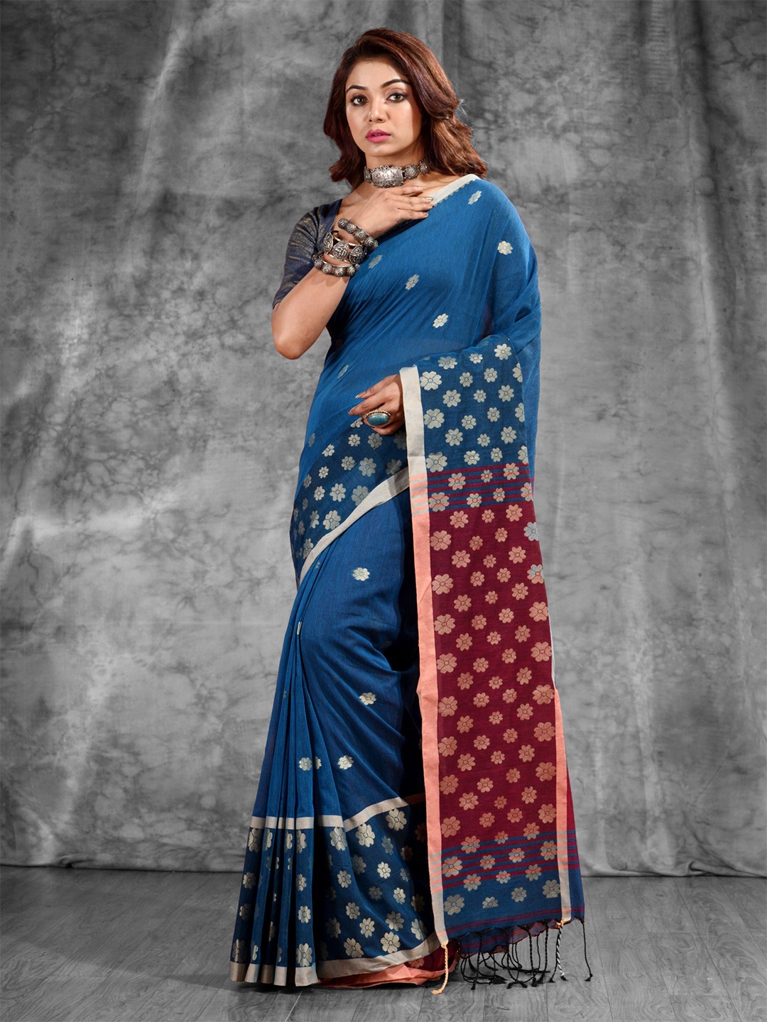 

Charukriti Teal & Purple Woven Design Zari Pure Cotton Saree
