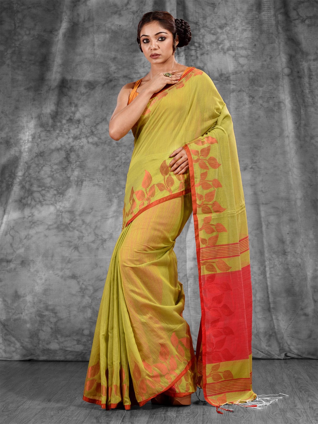 

Charukriti Green & Orange Woven Design Saree