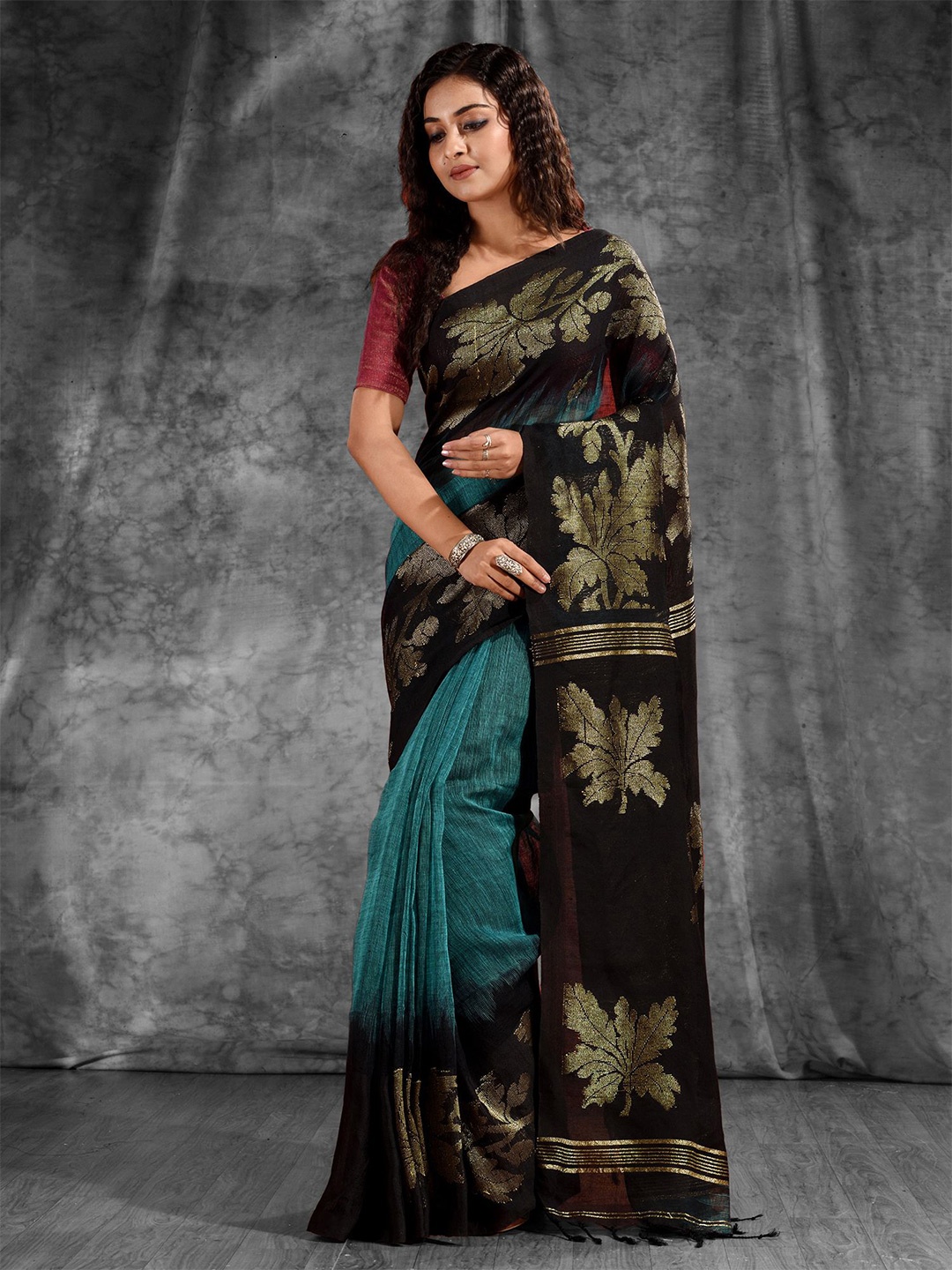 

Charukriti Teal & Black Woven Design Zari Pure Linen Saree