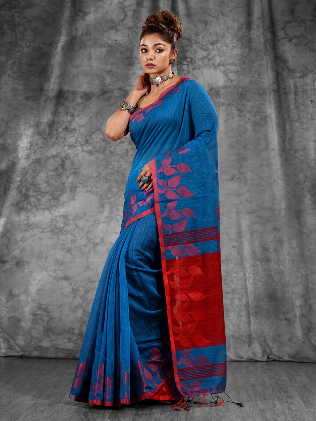 

Charukriti Teal & Maroon Floral Woven Design Zari Saree