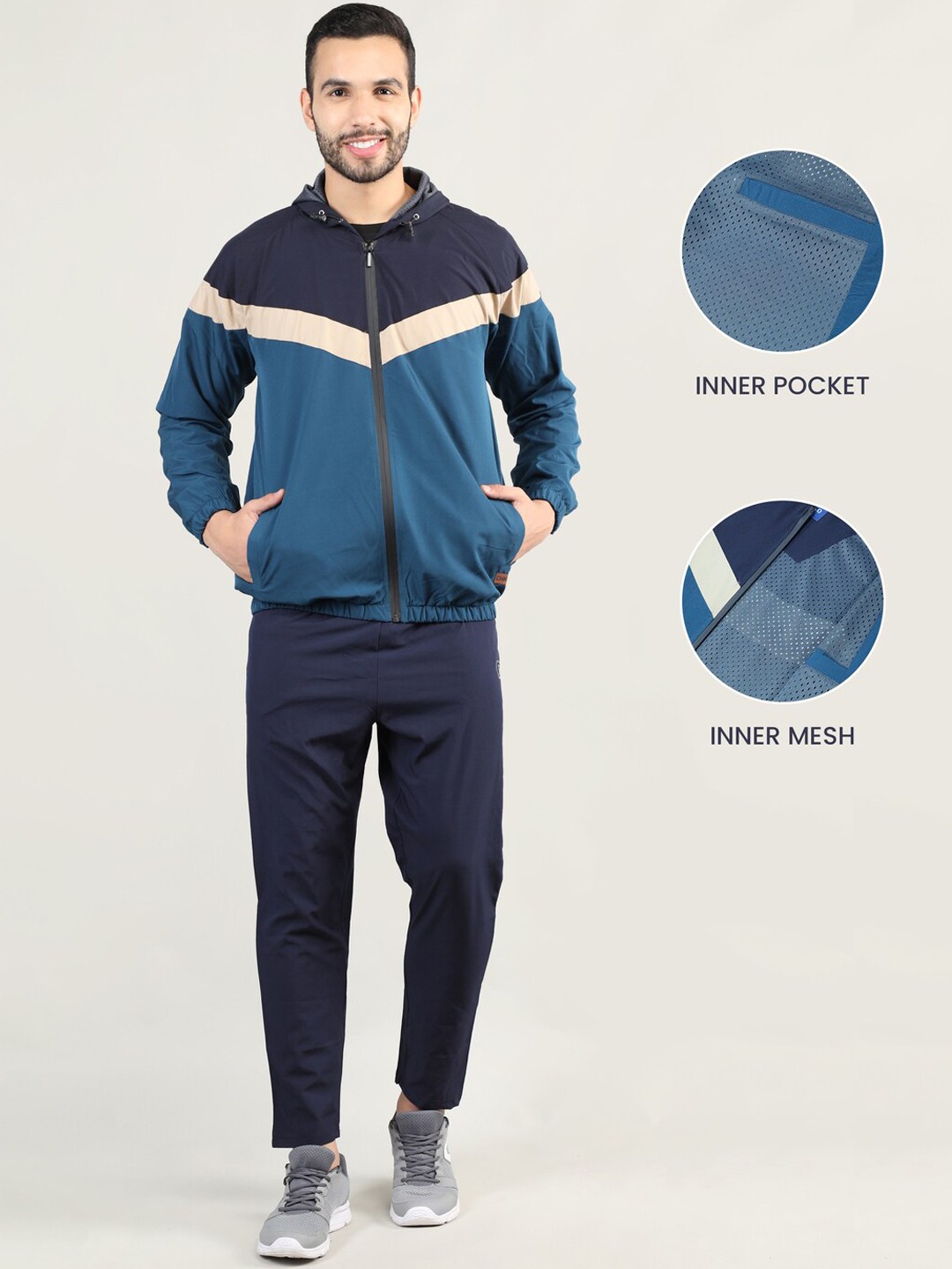 

CHKOKKO Men Navy Blue & Petrol Blue Colorblocked Windcheater Tracksuit