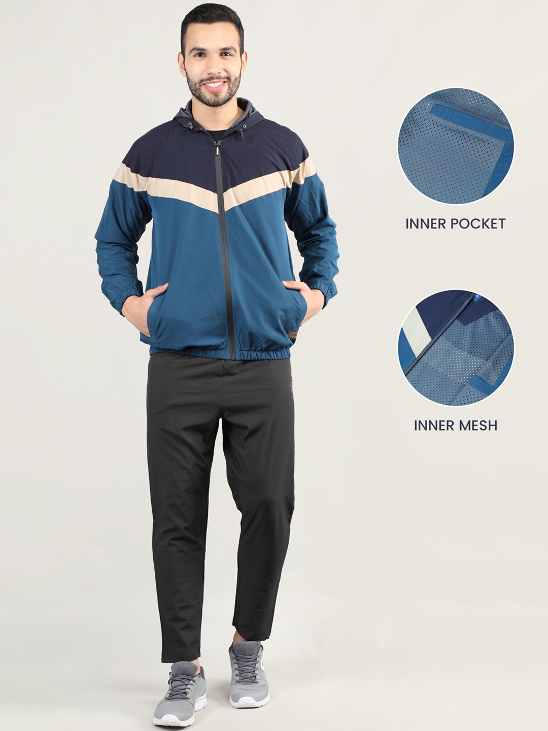 

CHKOKKO Men Navy Blue & Teal Blue Color Blocked Windcheater Tracksuits