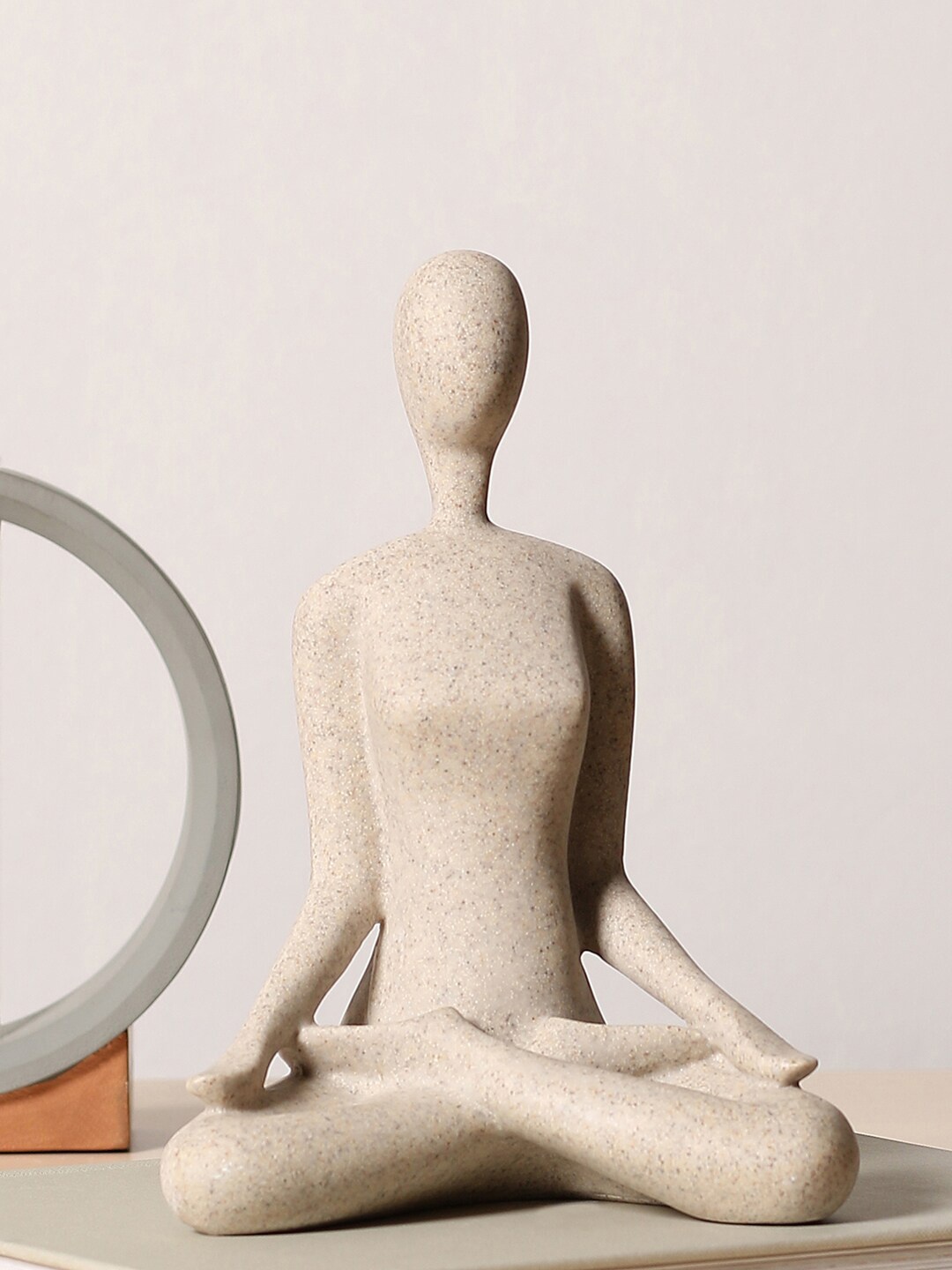 

Bonhomie Beige Feminine Ceramic Showpiece