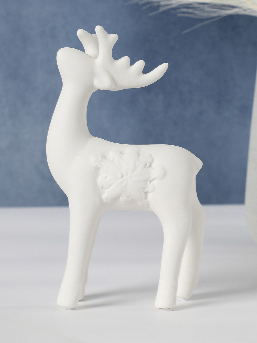 

Bonhomie White Reindeer Shaped Ceramic Sculpture Showpiece