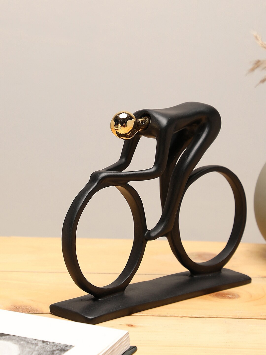 

Bonhomie Black Figure On A Cycle Ceramic Showpieces