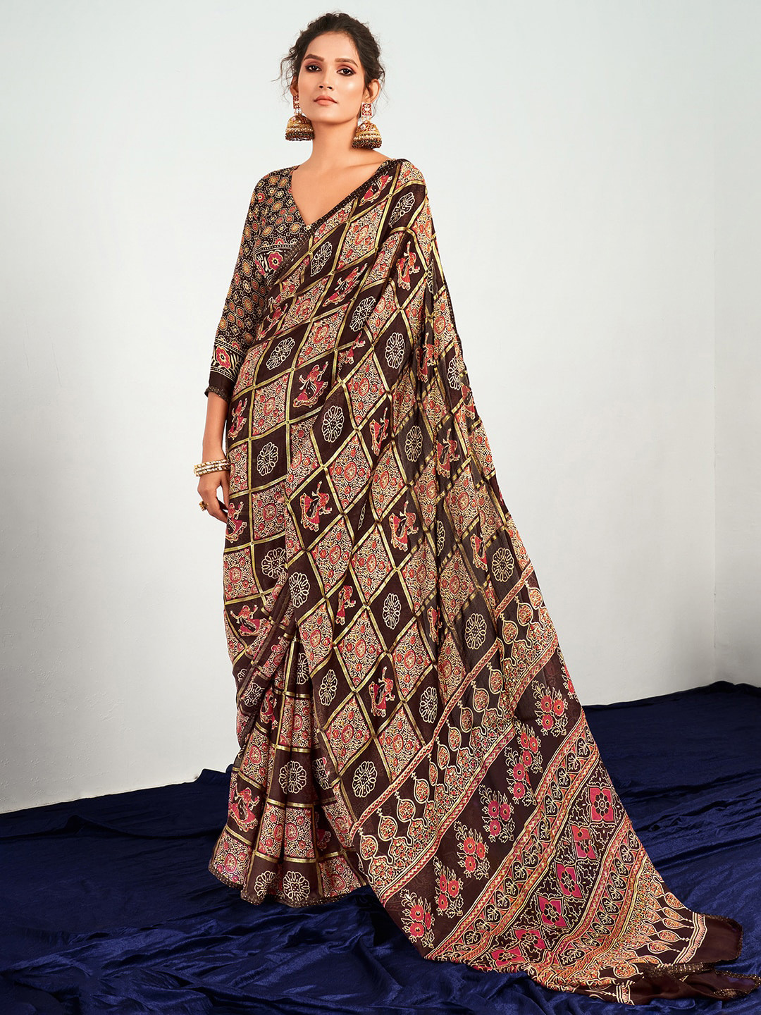 

Saree mall Brown & Red Ethnic Motifs Pure Georgette Patola Saree
