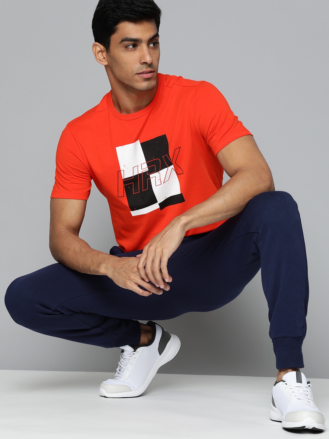 

HRX by Hrithik Roshan Men Orange & Black Brand Logo Printed T-shirt