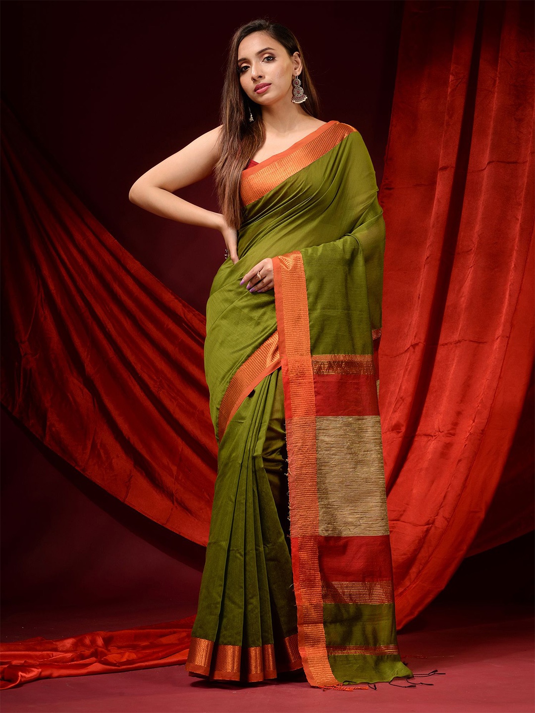 

Charukriti Green & Orange Zari Silk Cotton Saree