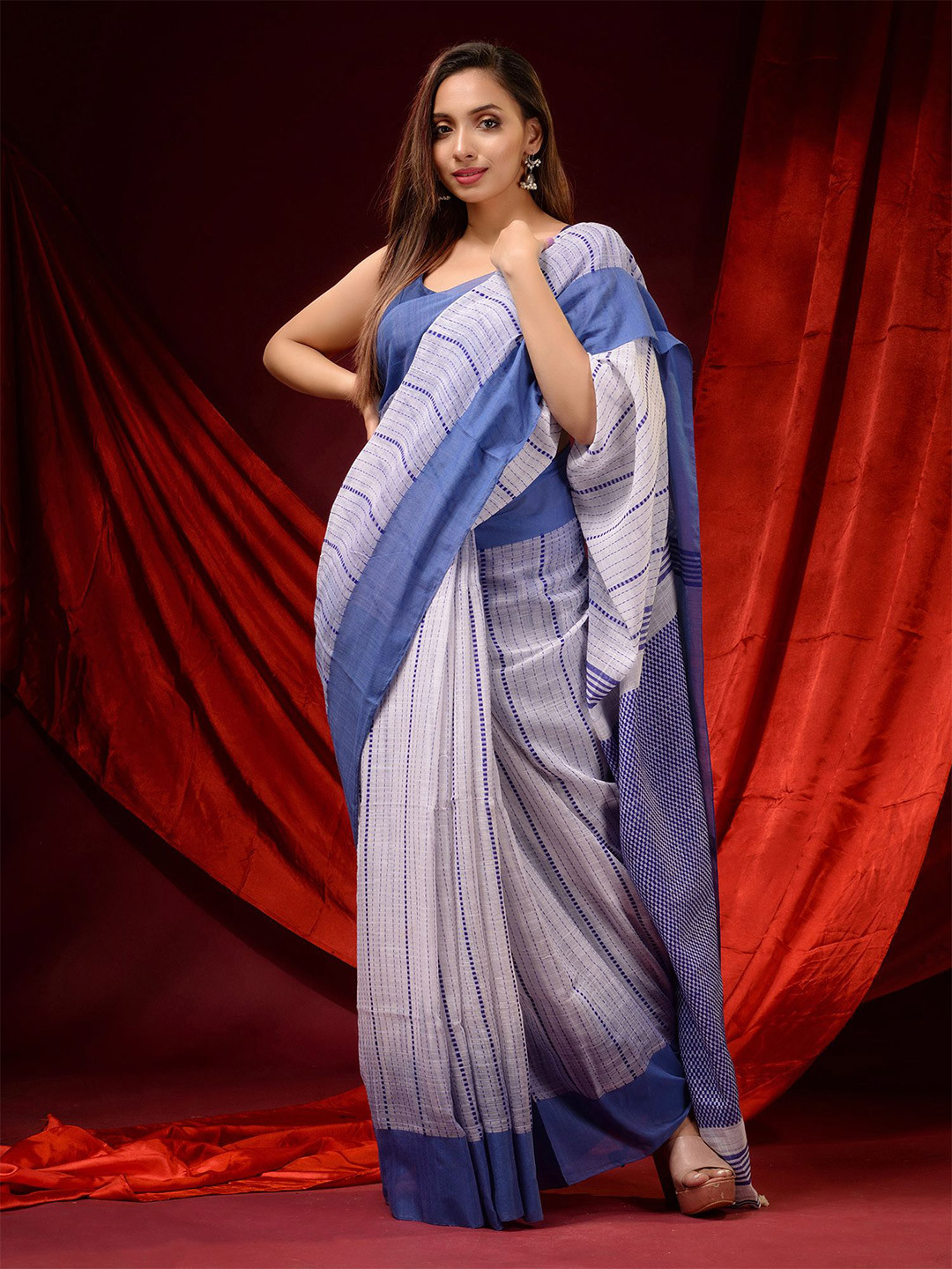 

Charukriti White & Blue Striped Pure Cotton Saree