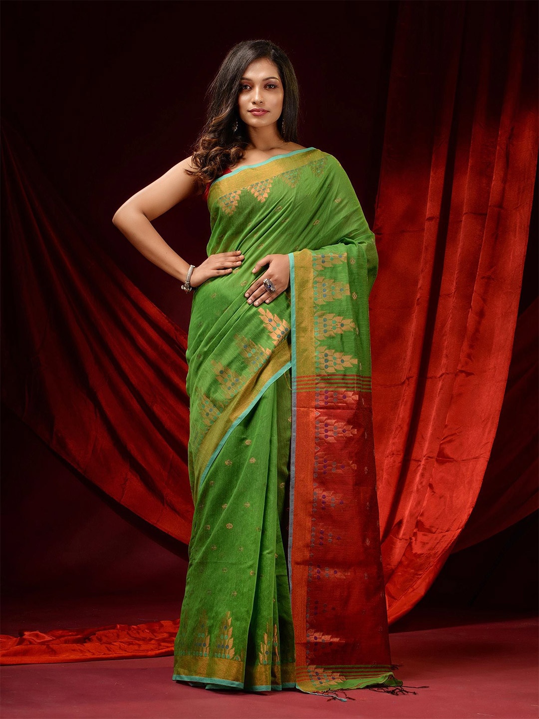 

Charukriti Green & Red Ethnic Motifs Woven Design Zari Saree