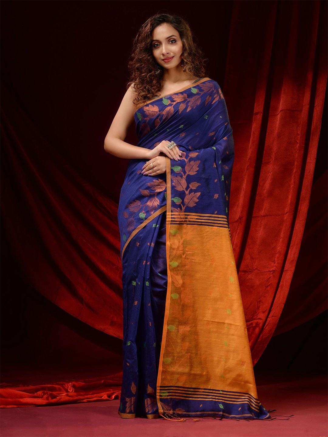 

Charukriti Blue & Gold-Toned Floral Woven Design Zari Saree