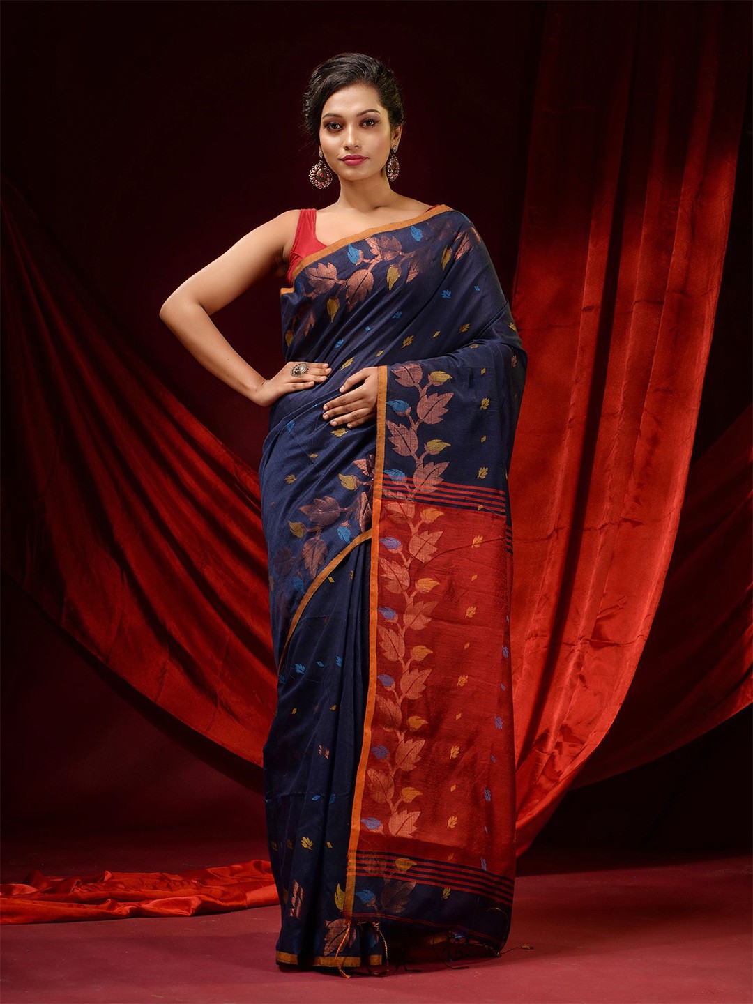 

Charukriti Blue & Red Floral Woven Design Zari Saree