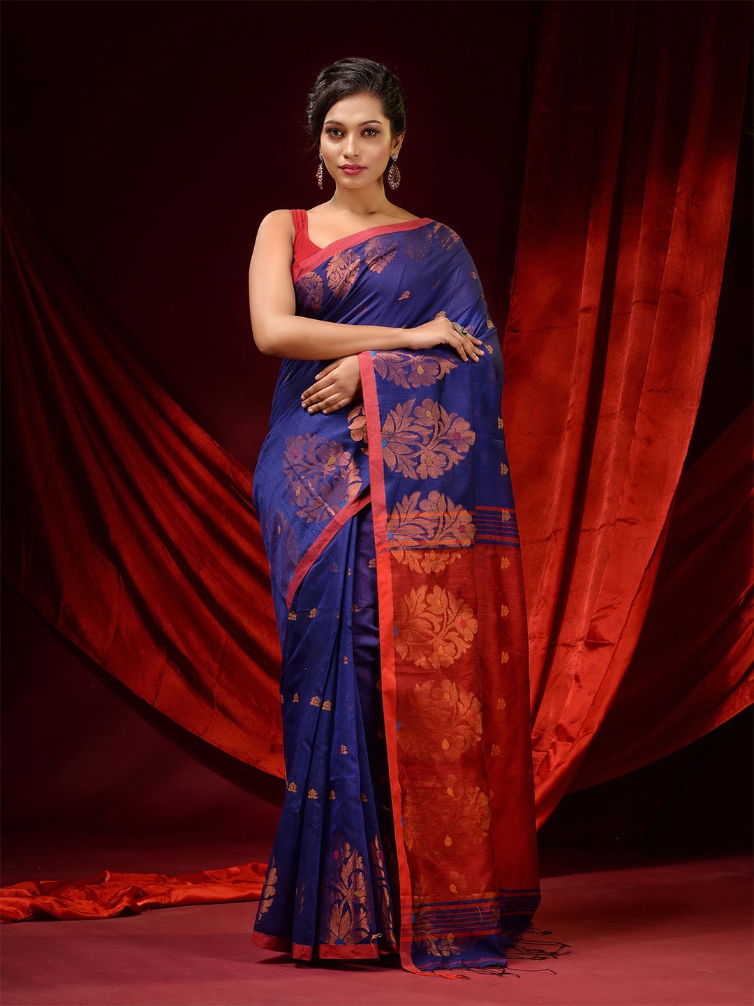 

Charukriti Blue & Red Ethnic Motifs Zari Saree