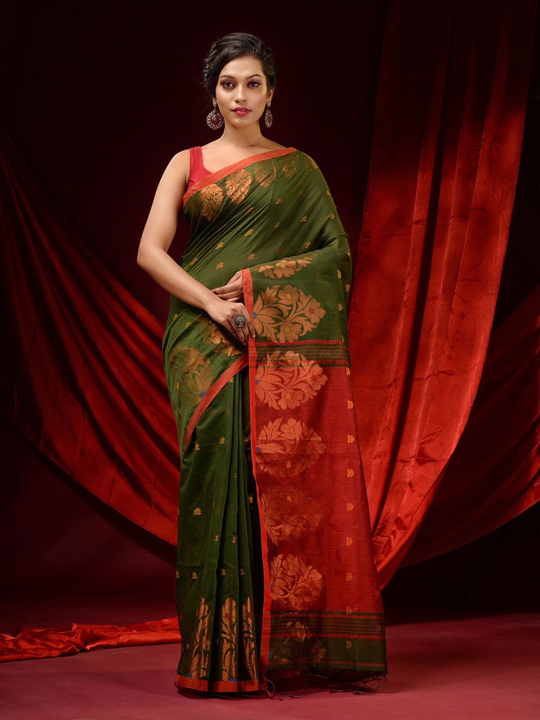 

Charukriti Green & Red Ethnic Motifs Zari Saree