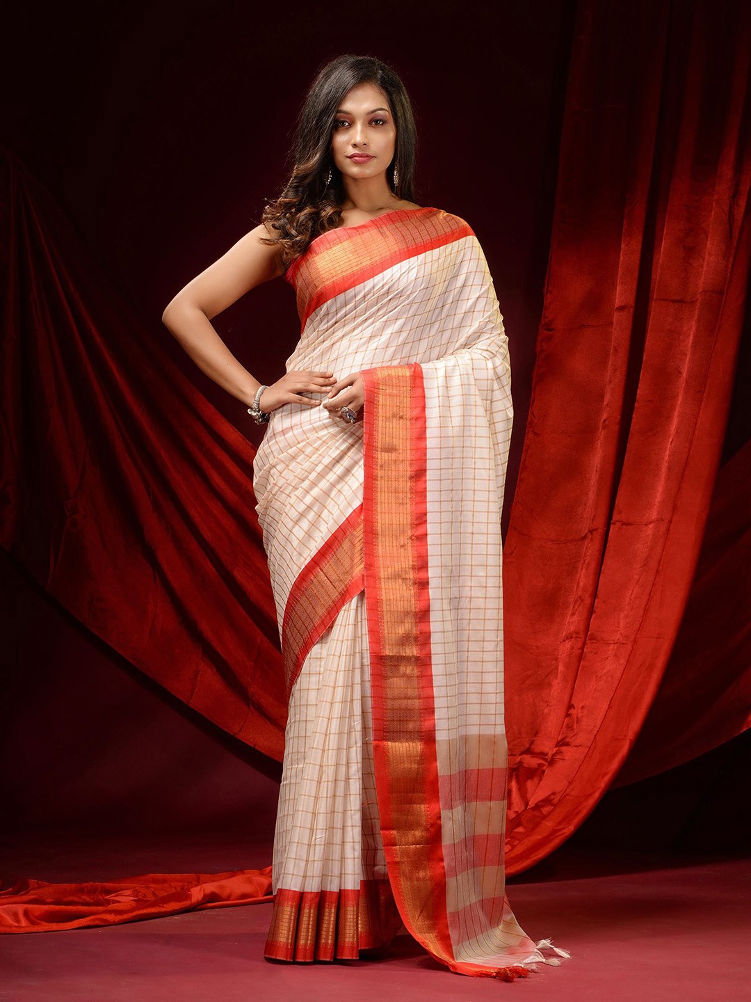 

Charukriti Off White & Orange Woven Design Zari Silk Cotton Saree