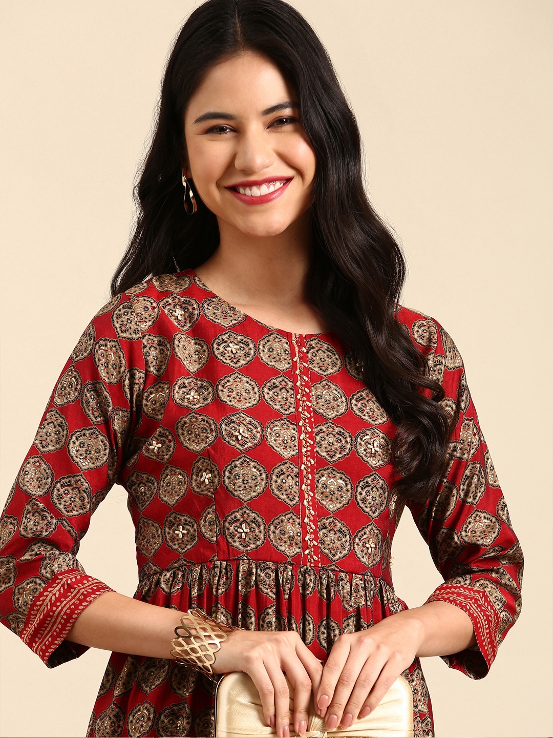 

SHOWOFF Women Maroon Ethnic Motifs Printed Empire Beads and Stones Chanderi Cotton Kurta with Trousers