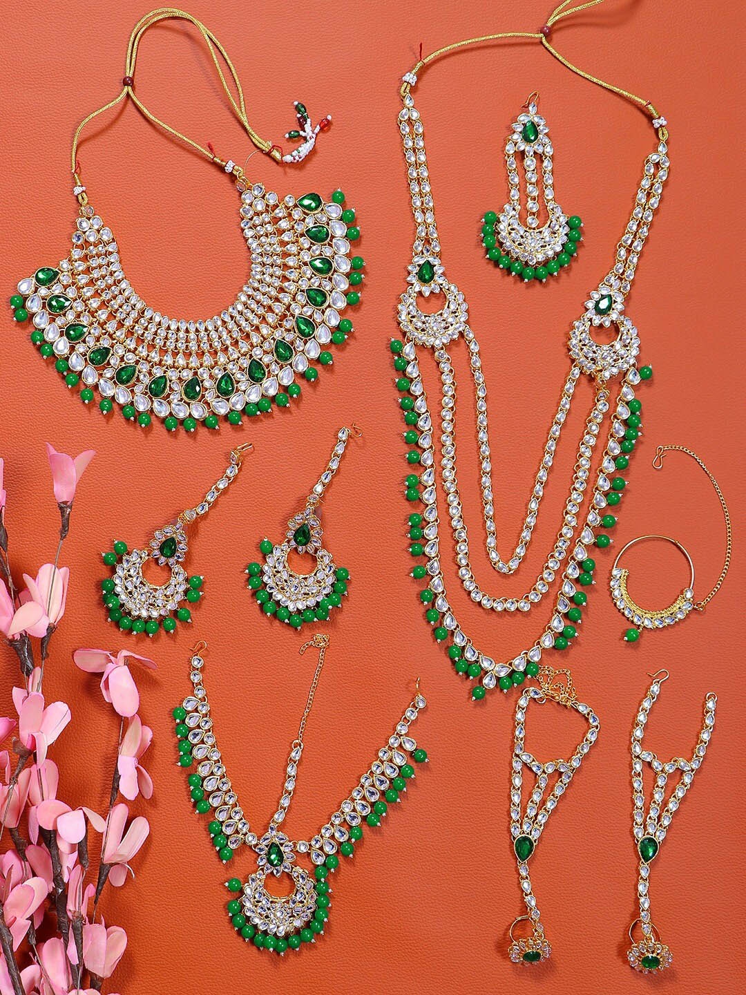 

Crunchy Fashion Gold-Plated Green Kundan Studded & Pearl Beaded Jewellery Sets