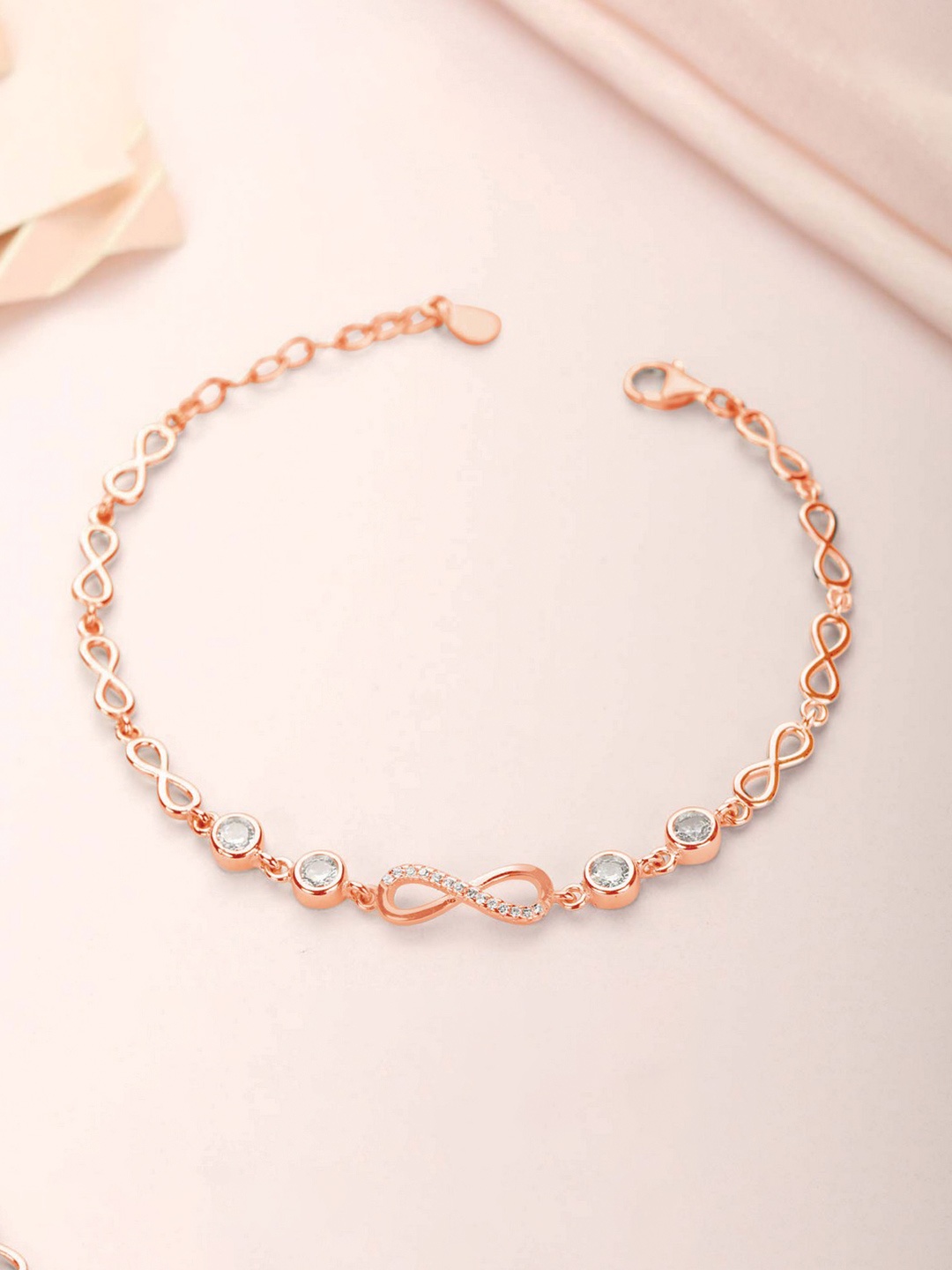 

Zavya Women Gold-Toned Silver Cubic Zirconia Rose Gold-Plated Charm Bracelet