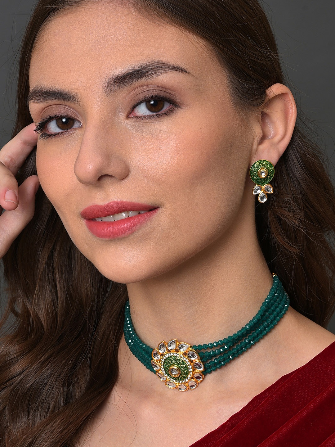 

SOHI Women Gold-Plated White & Green Stone-Studded Jewellery Set