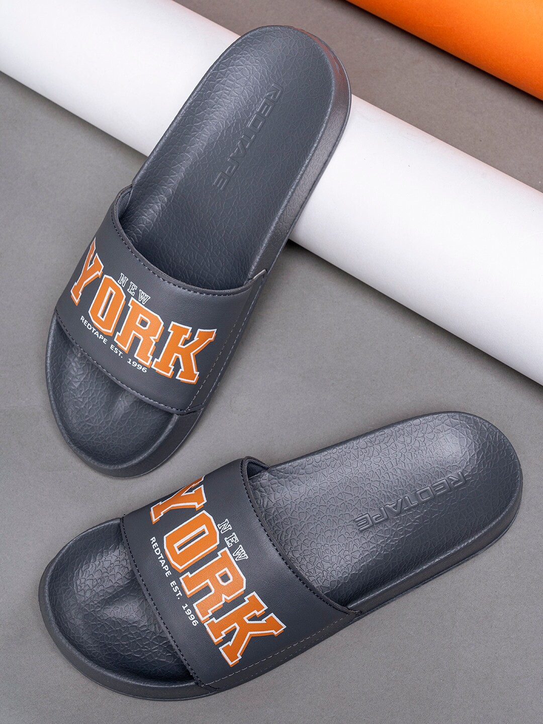 

Red Tape Men Grey & Orange Printed Sliders