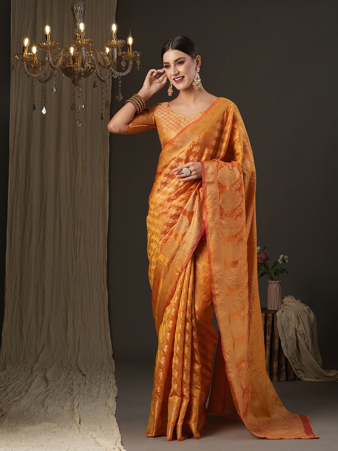 

Saree mall Orange & Green Ethnic Motifs Zari Banarasi Saree