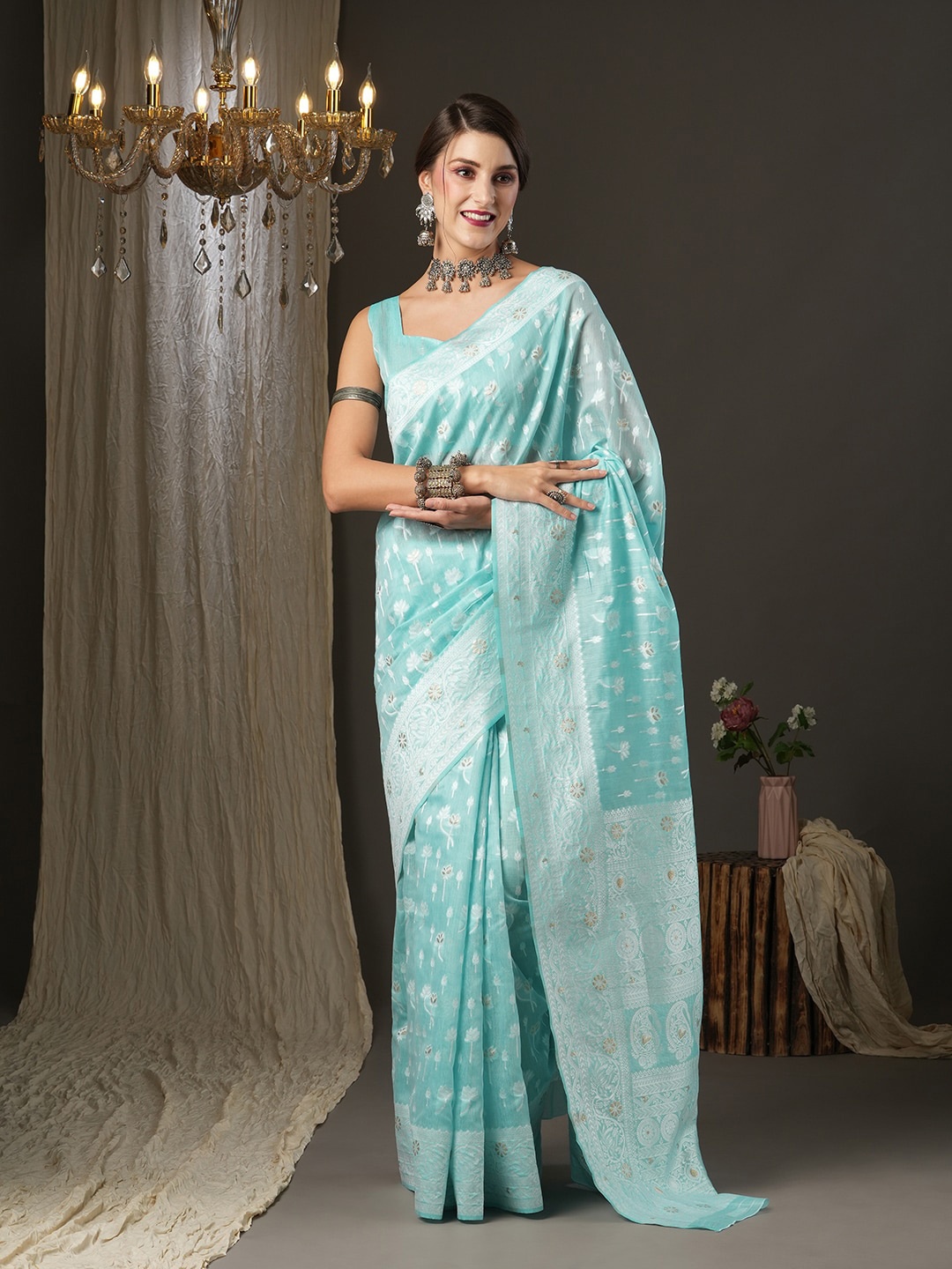 

Saree mall Turquoise Blue & Silver-Toned Woven Design Zari Silk Cotton Muga Sarees