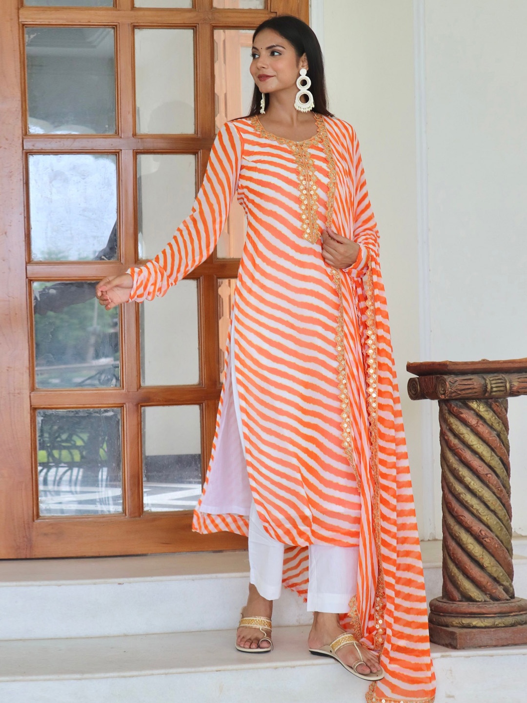 

OneWe Women Leheriya Mirror Work Regular Kurta with Trousers & Dupatta, Orange